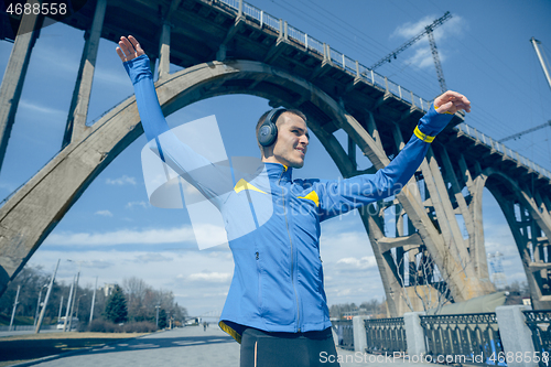 Image of Man running on city background at morning