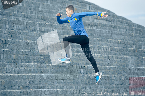 Image of Man running on city background at morning.