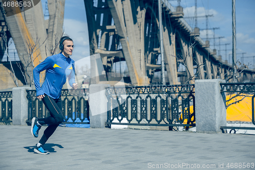 Image of Man running on city background at morning.