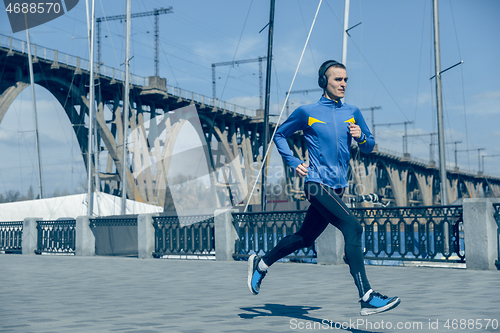 Image of Man running on city background at morning.