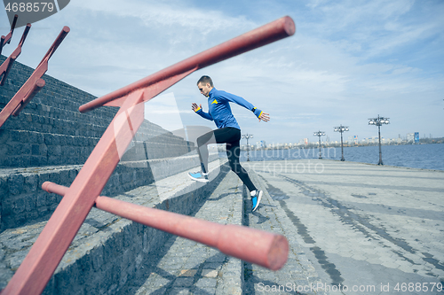 Image of Man running on city background at morning.