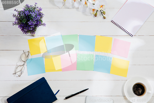 Image of Message at colorful note papers on a desk background.