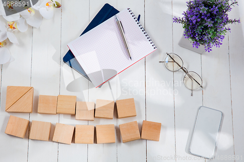 Image of Message at wooden cubes on a desk background.