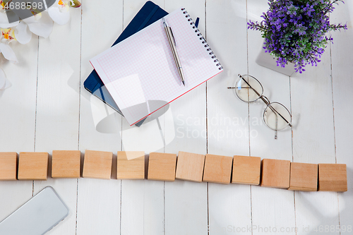 Image of Message at wooden cubes on a desk background.