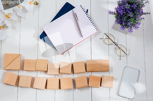 Image of Message at wooden cubes on a desk background.