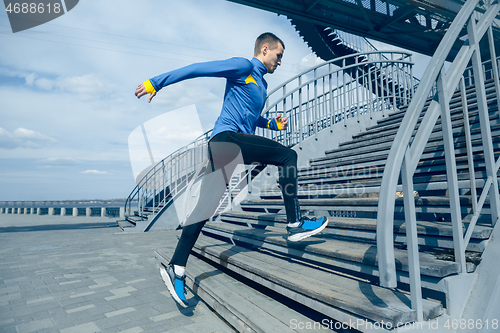 Image of Man running on city background at morning.