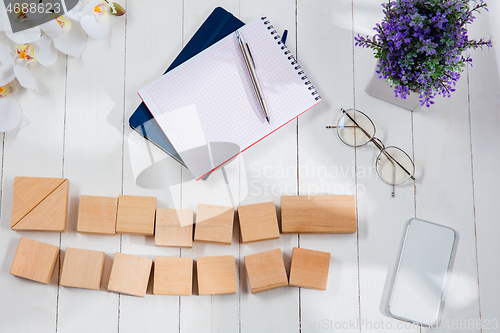 Image of Message at wooden cubes on a desk background.