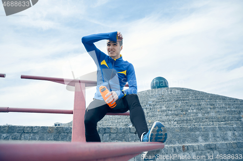 Image of Man on city background at morning. Healthy lifestyle concept.