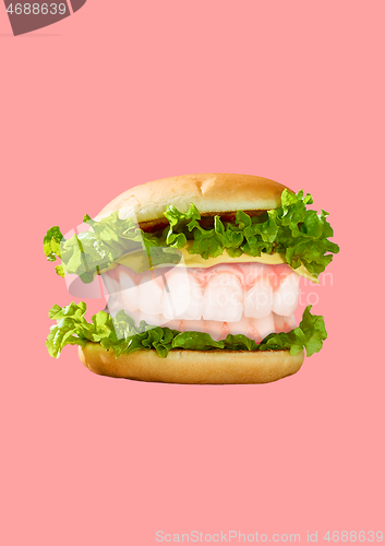 Image of Modern art collage. Hamburger and white teeth