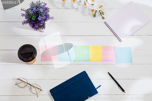 Image of Message at colorful note papers on a desk background.