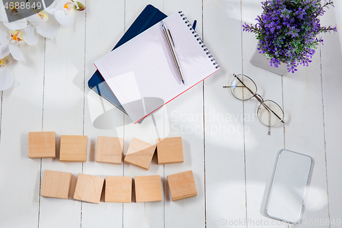 Image of Message at wooden cubes on a desk background.