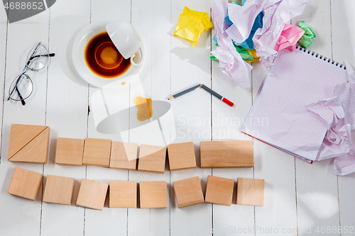 Image of Message in wooden cubes on a desk background.