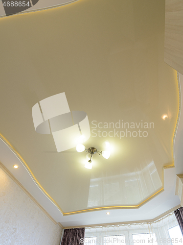 Image of View of the beautiful rich stretch ceiling of the original form in the interior of the bedroom