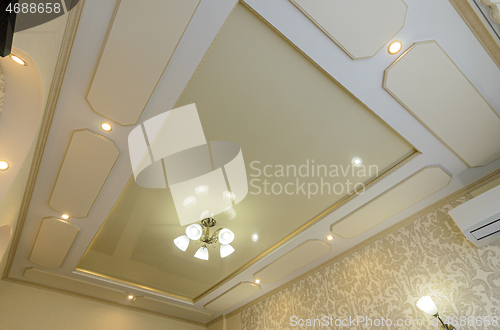 Image of Original multi-level stretch ceiling with plasterboard elements in the bedroom interior