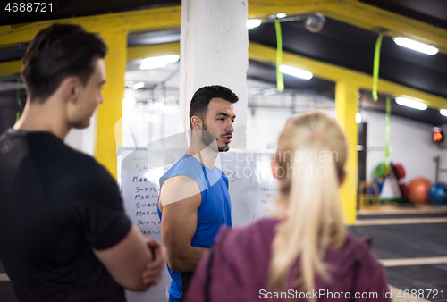 Image of athletes getting instructions from trainer