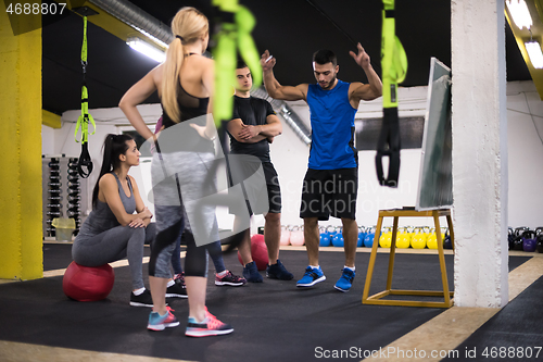 Image of athletes getting instructions from trainer