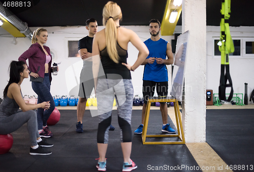 Image of athletes getting instructions from trainer