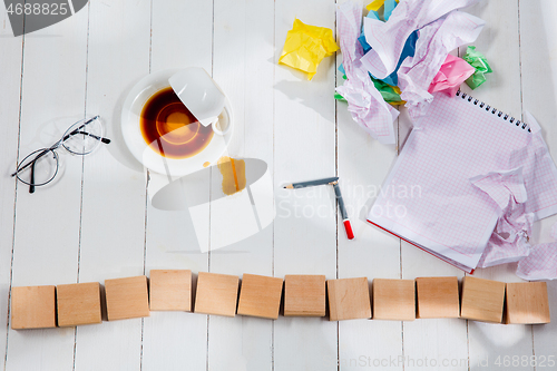 Image of Message in wooden cubes on a desk background.