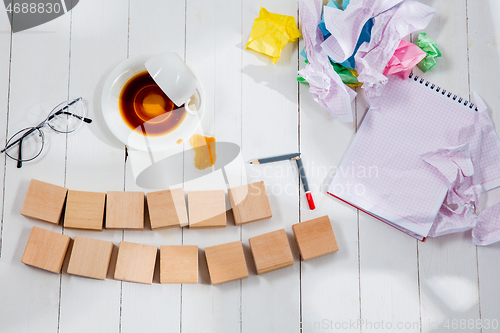 Image of Message in wooden cubes on a desk background.