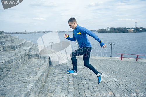 Image of Man running on city background at morning.