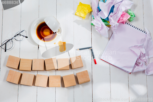 Image of Message in wooden cubes on a desk background.