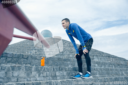 Image of Man on city background at morning. Healthy lifestyle concept.