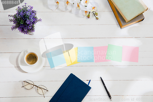 Image of Message at colorful note papers on a desk background.