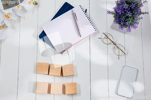 Image of Message at wooden cubes on a desk background.