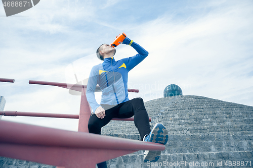 Image of Man on city background at morning. Healthy lifestyle concept.