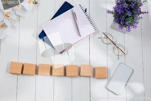 Image of Message at wooden cubes on a desk background.