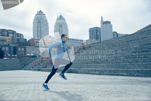 Image of Man running on city background at morning.