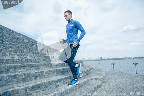 Image of Man running on city background at morning.