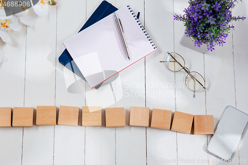 Image of Message at wooden cubes on a desk background.