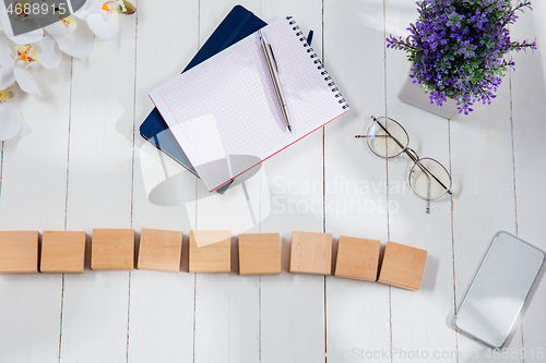 Image of Message at wooden cubes on a desk background.