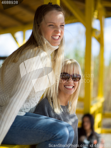 Image of Women Smiling And Enjoying Life at Beach