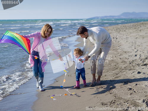 Image of happy family enjoying vecation during autumn day