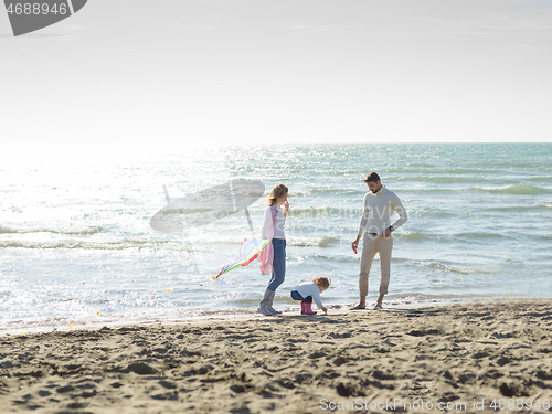Image of happy family enjoying vecation during autumn day