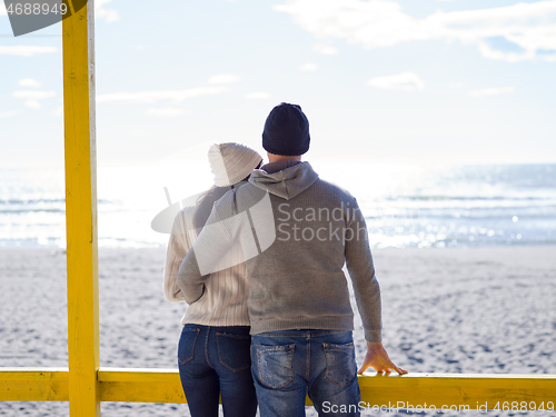 Image of Couple chating and having fun at beach bar