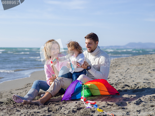 Image of Young family enjoying vecation during autumn day