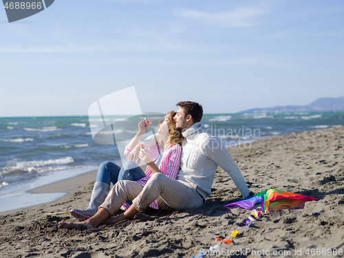 Image of young couple enjoying time together at beach