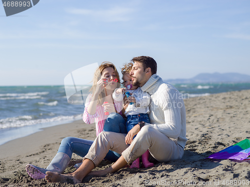 Image of Young family enjoying vecation during autumn day