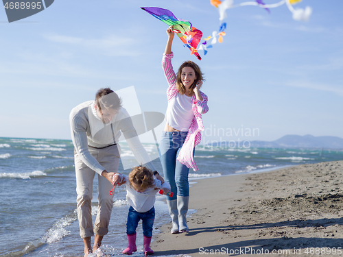 Image of happy family enjoying vecation during autumn day