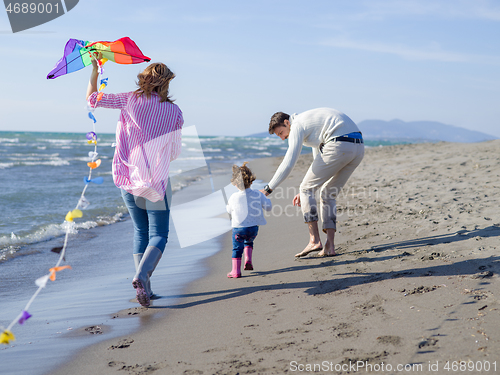 Image of happy family enjoying vecation during autumn day