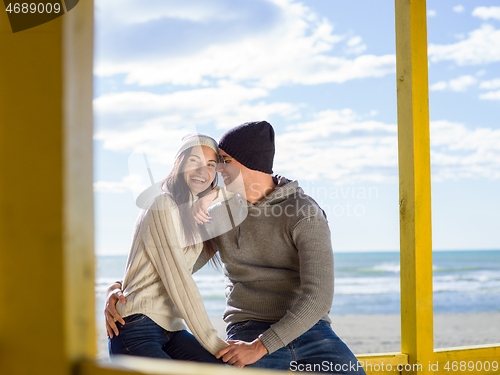 Image of Couple chating and having fun at beach bar