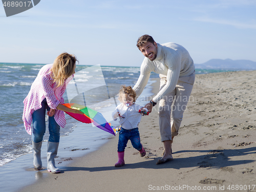 Image of happy family enjoying vecation during autumn day