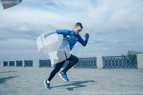 Image of Man running on city background at morning.