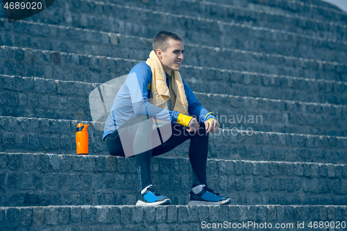 Image of Man on city background at morning. Healthy lifestyle concept.