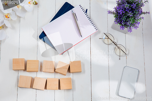 Image of Message at wooden cubes on a desk background.