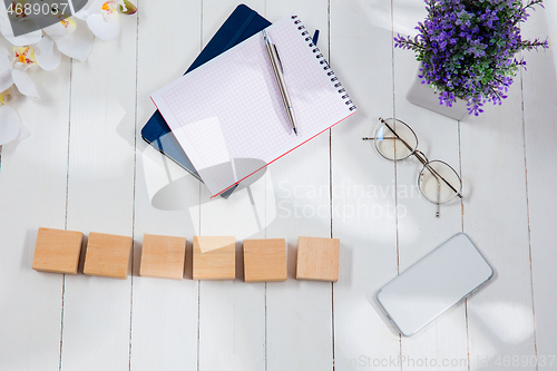 Image of Message at wooden cubes on a desk background.