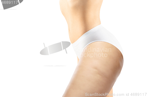 Image of Overweight woman with fat cellulite legs and buttocks, obesity female body in white underwear isolated on white background